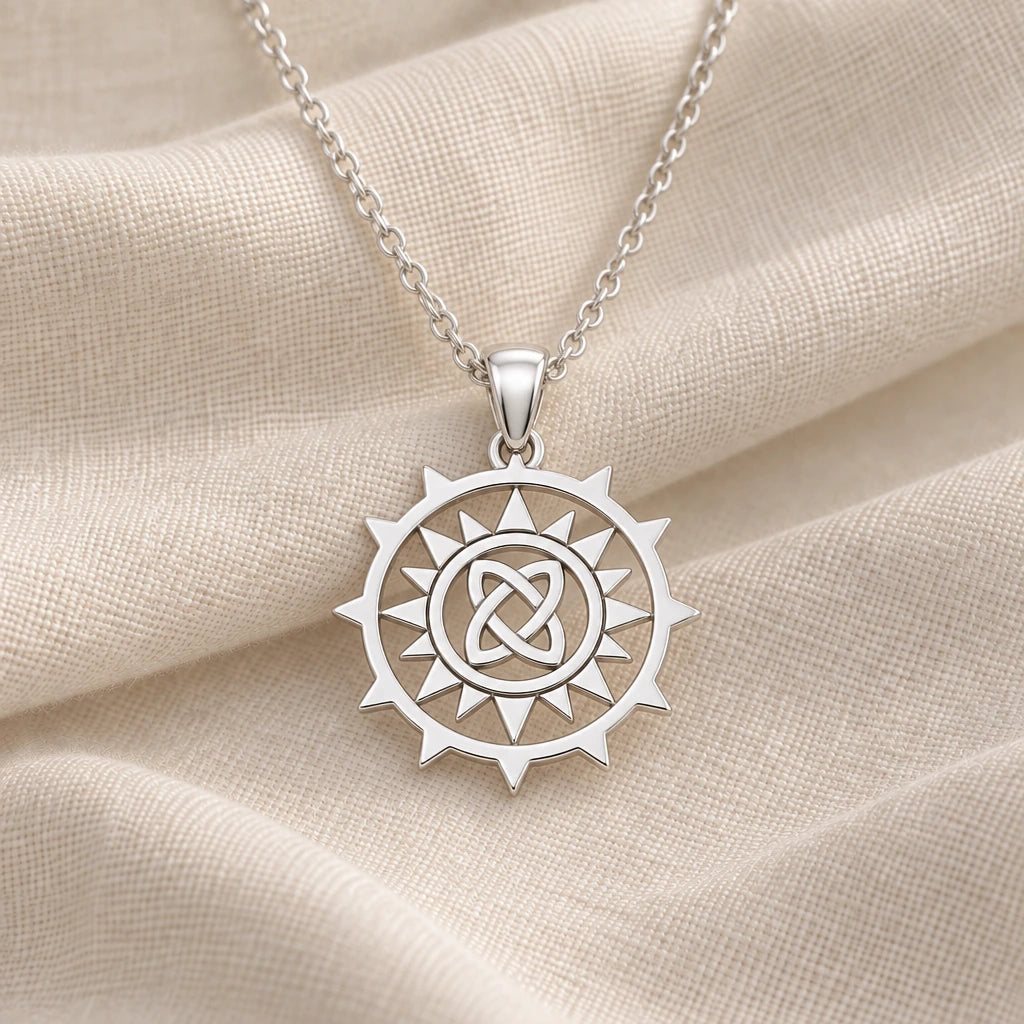 925 sterling silver triquetra sun knot pendant necklace on cream fabric