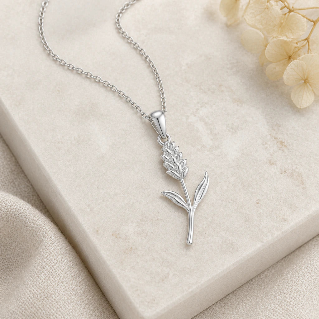 Close-up of silver statice flower pendant showing the sculpted detail