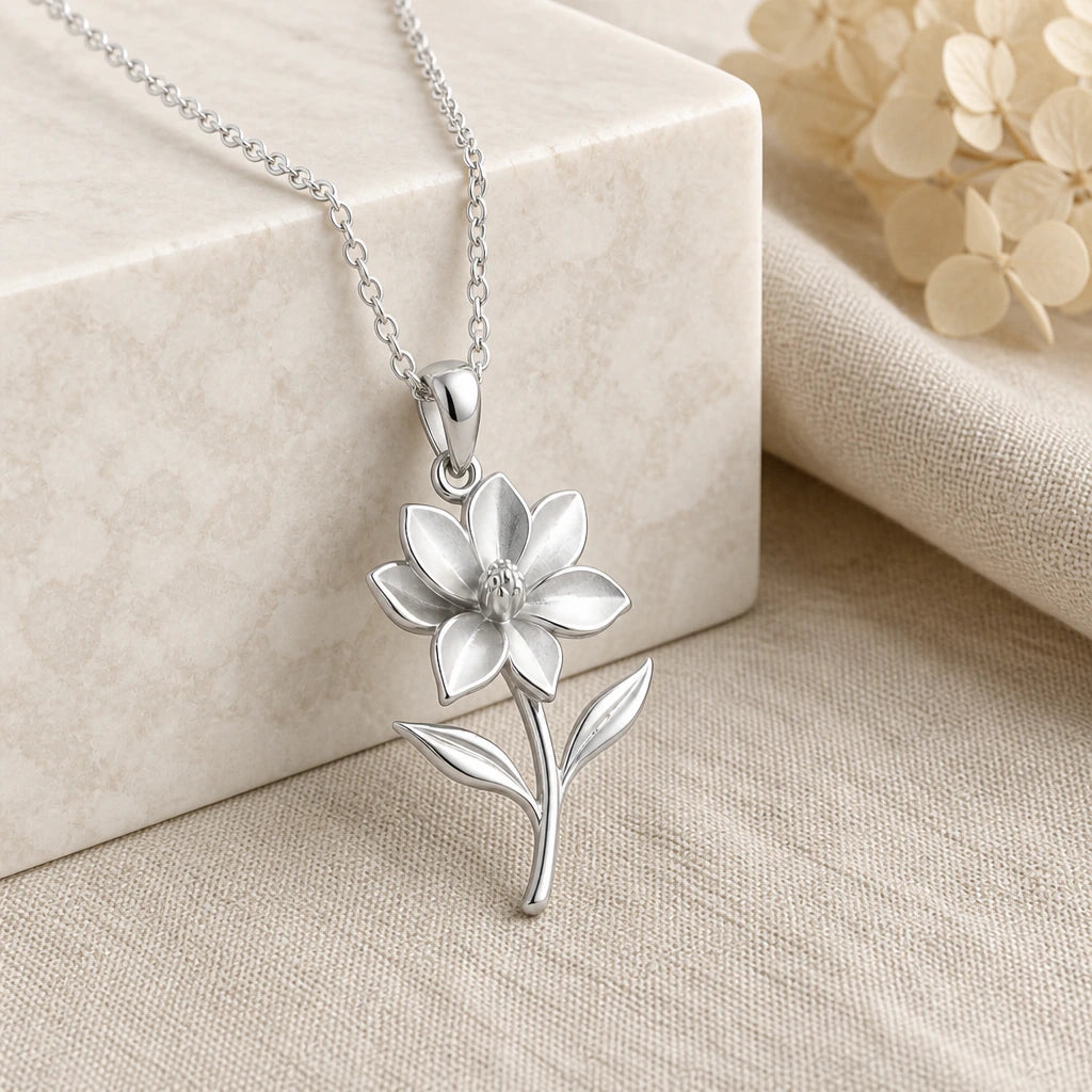 925 sterling silver magnolia flower pendant necklace on softly folded cream linen