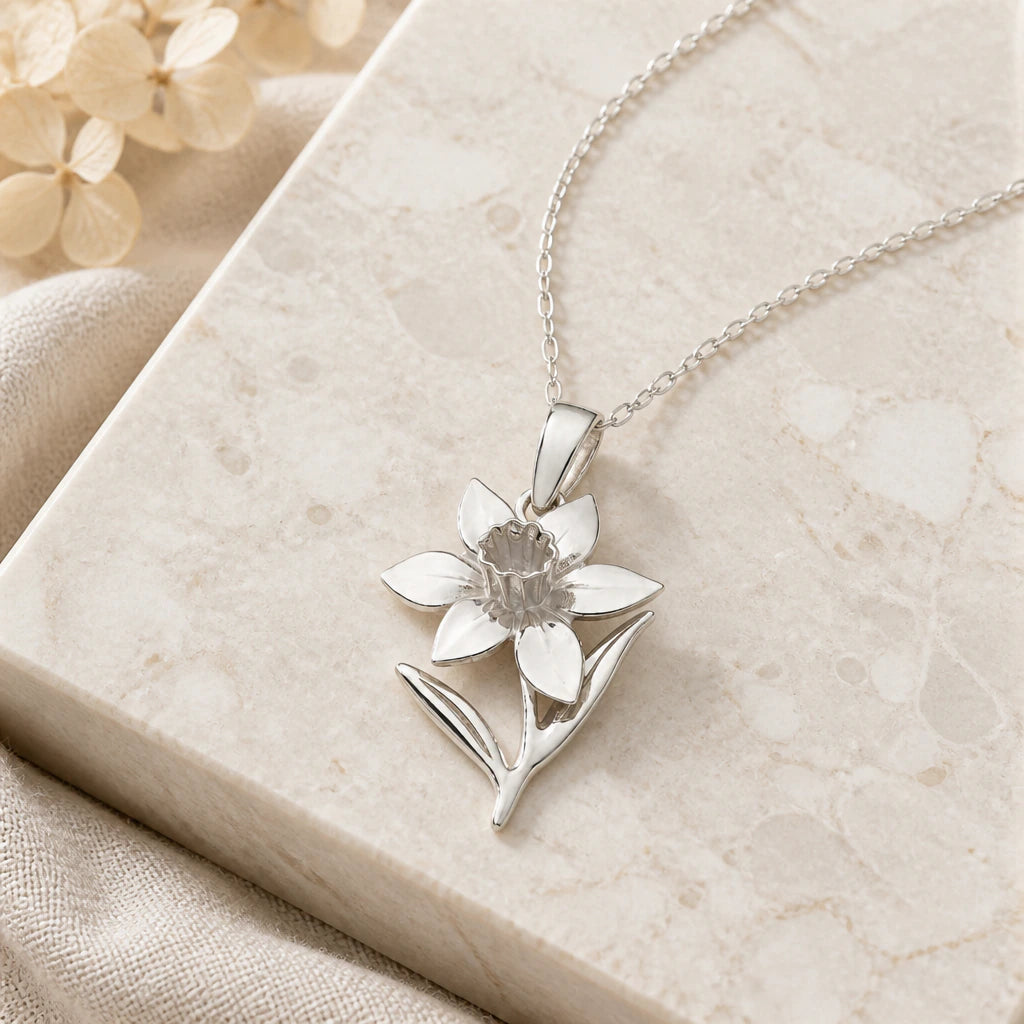 Close-up of silver daffodil narcissus flower pendant showing the sculpted detail
