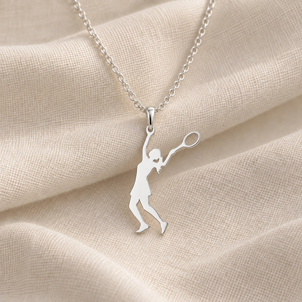 925 sterling silver tennis player serve pendant necklace on cream fabric