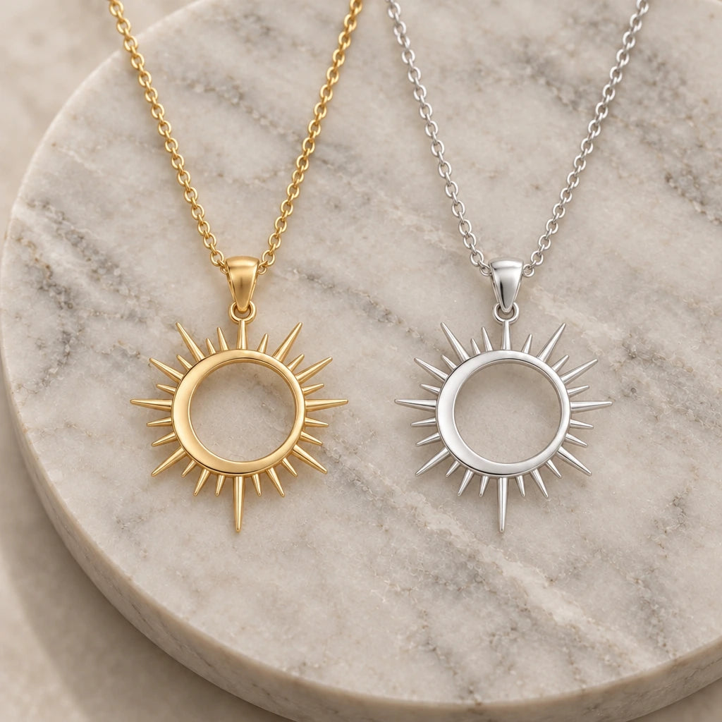 Solar Eclipse Ring pendant necklace in silver and gold finishes side by side