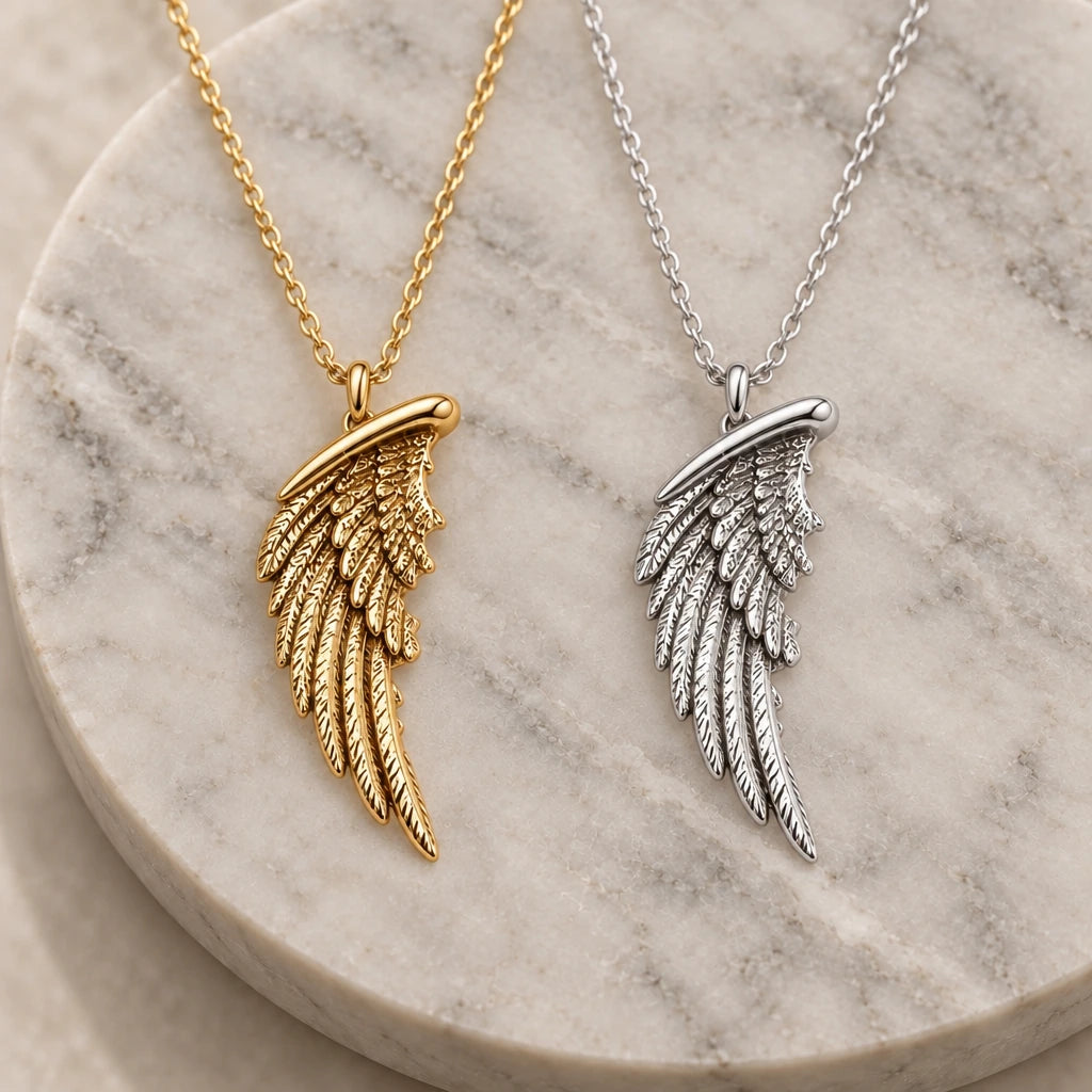 Feathered Wing pendant necklace in silver and gold finishes side by side