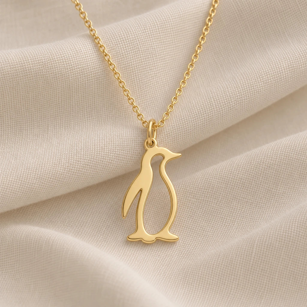 Penguin Outline pendant necklace in an 18k gold plated finish