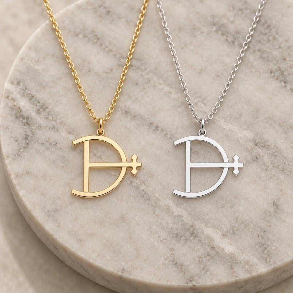 Magnesium Alchemy Symbol pendant necklace in silver and gold finishes side by side