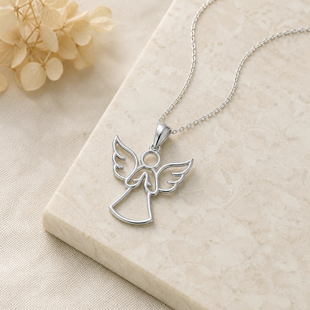Close-up of silver guardian angel pendant showing the sculpted detail