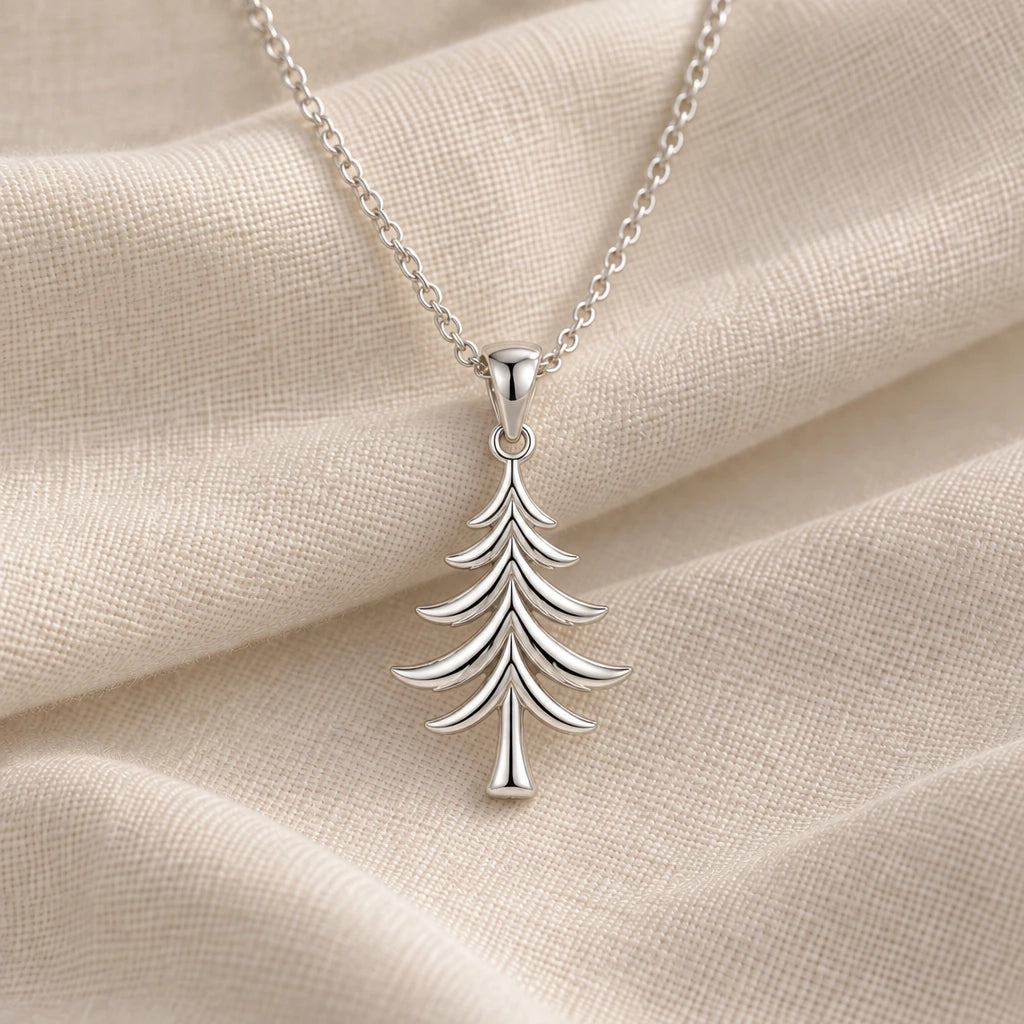 925 sterling silver cedar tree pendant necklace on cream fabric