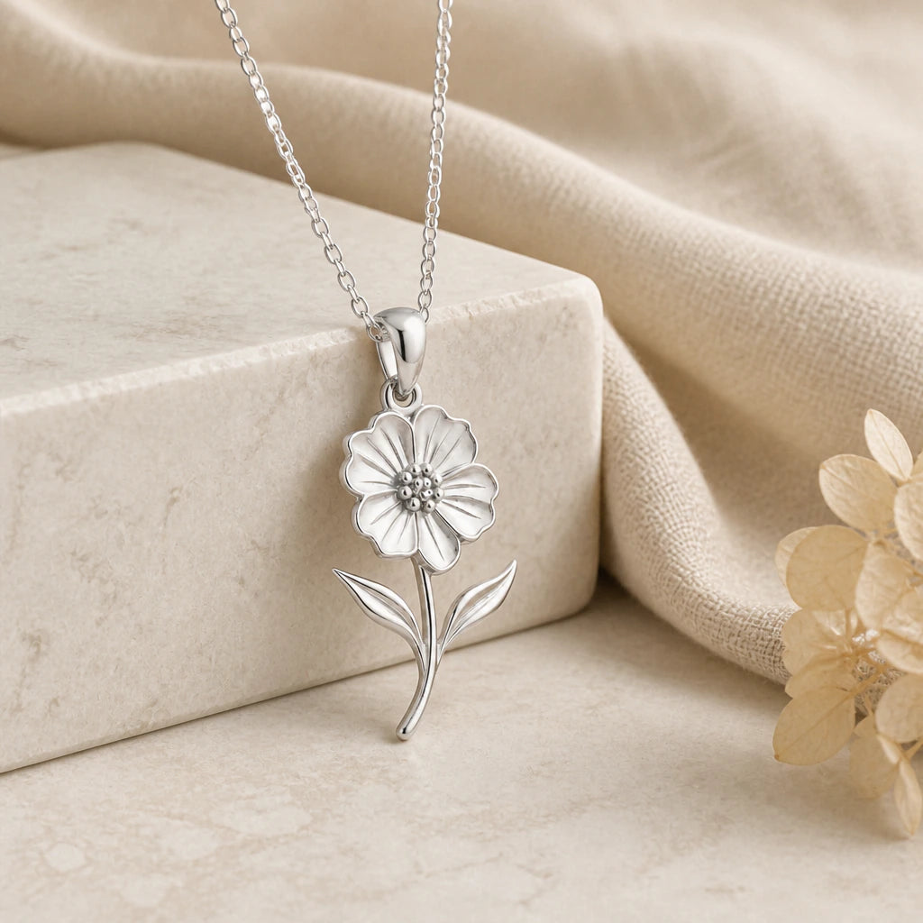 925 sterling silver petunia flower pendant necklace on softly folded cream linen