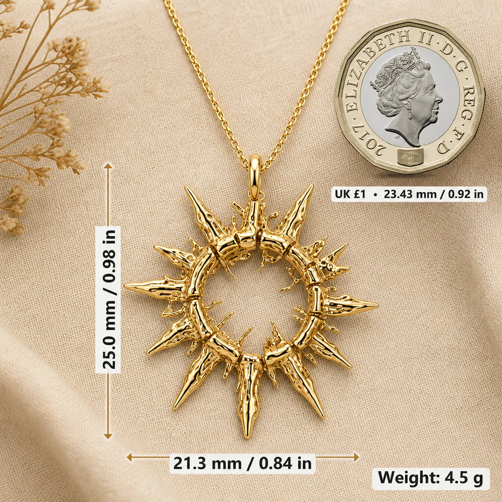 Sun necklace size image showing 25 mm height, 21.3 mm width and 4.5 g weight beside a UK pound coin