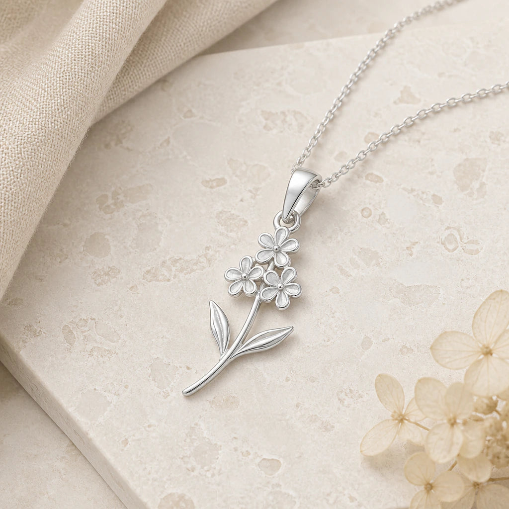 Close-up of silver heather flower pendant showing the sculpted detail