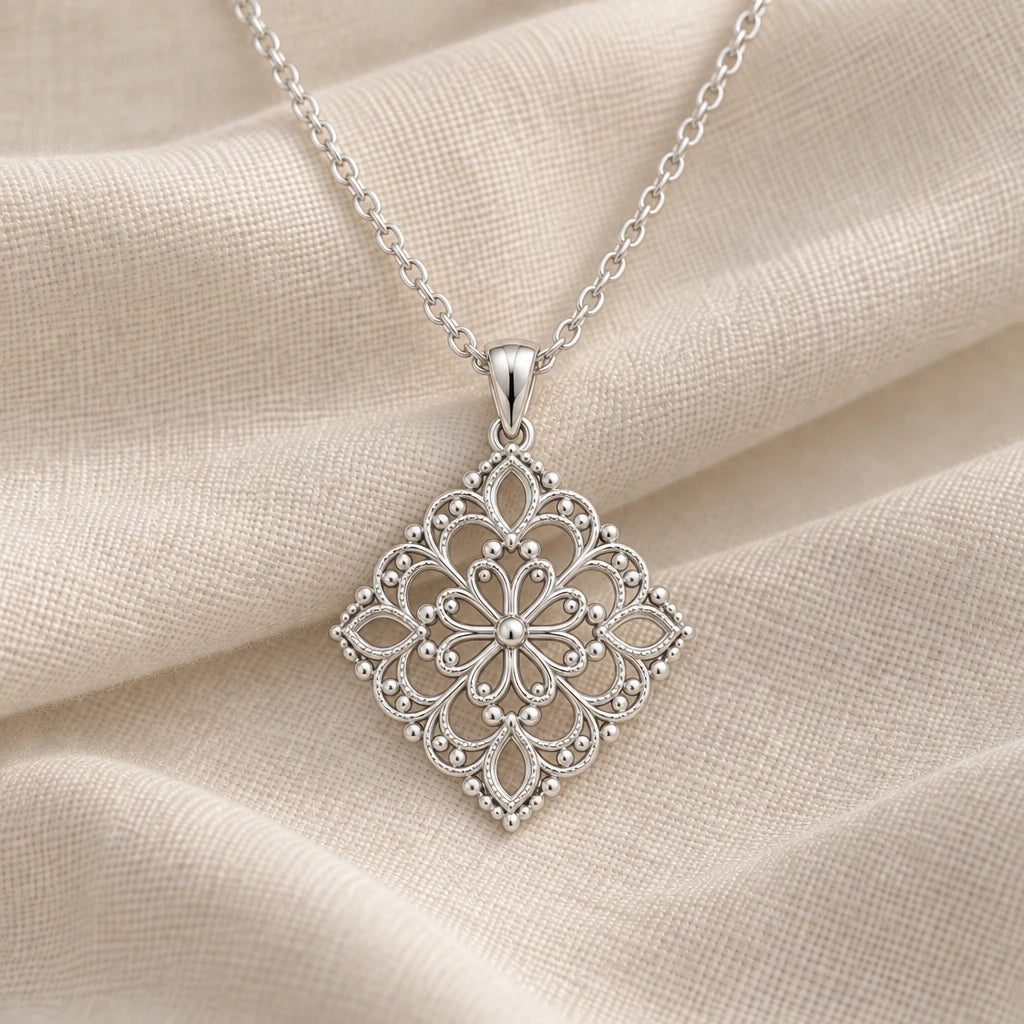 925 sterling silver lace filigree pendant necklace on cream fabric