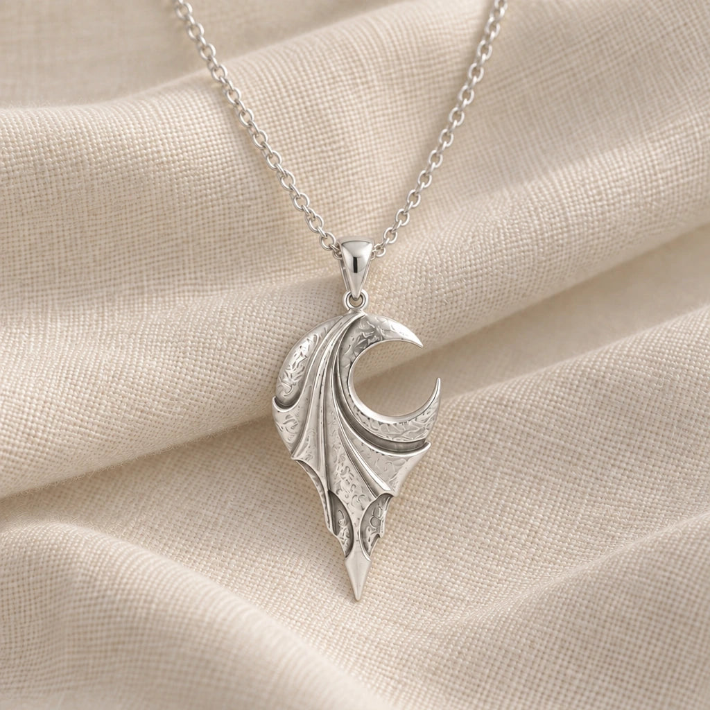 925 sterling silver veiled eclipse wing pendant necklace on cream fabric