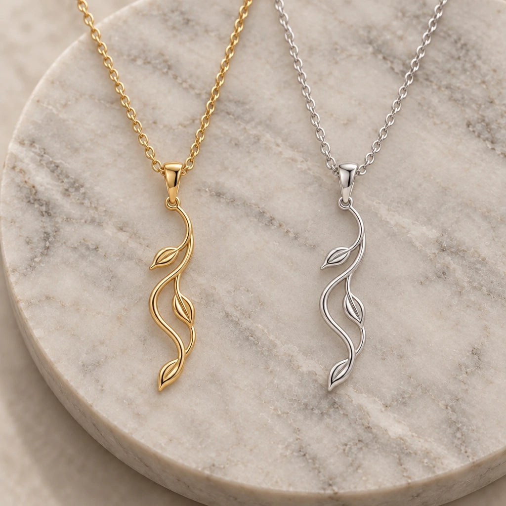 Aurora Vine pendant necklace in silver and gold finishes side by side