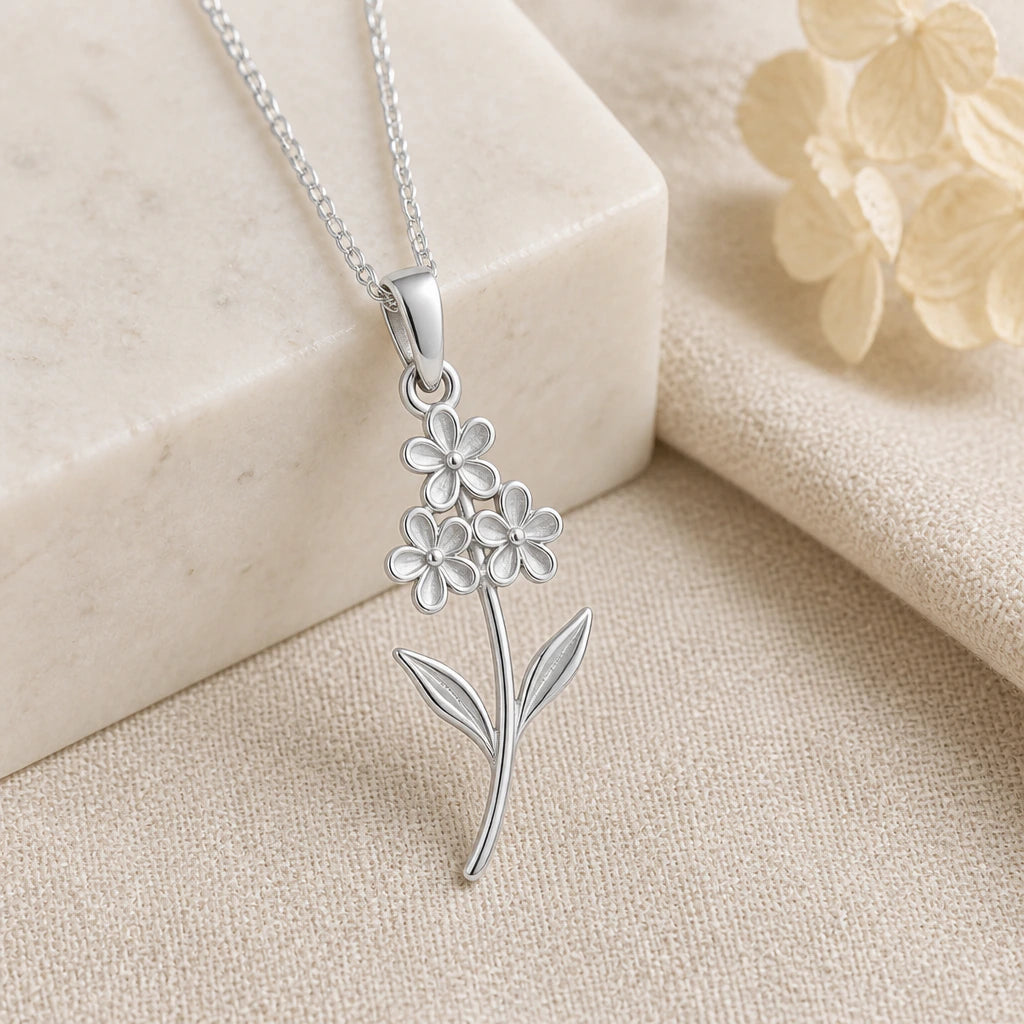 925 sterling silver heather flower pendant necklace on softly folded cream linen