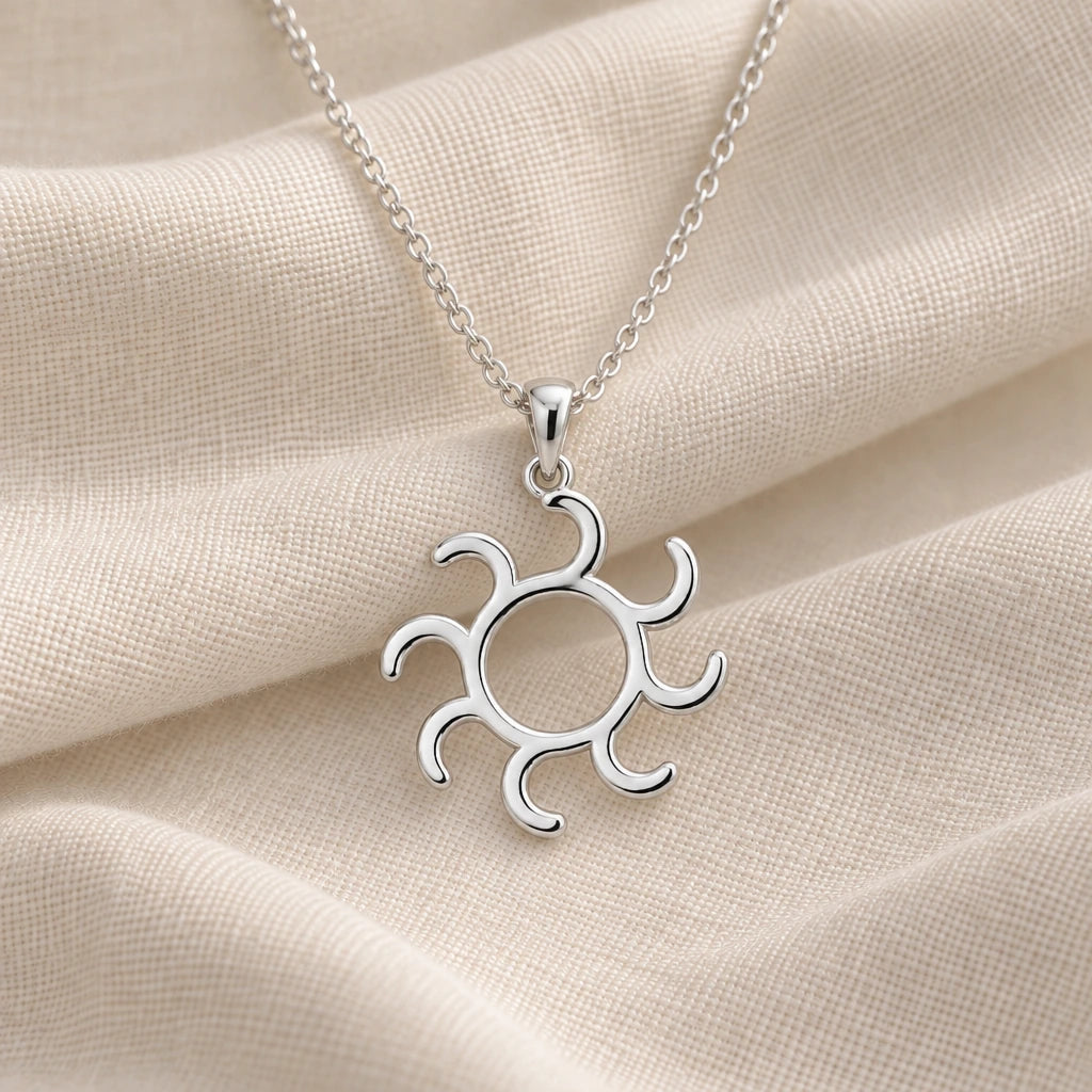 925 sterling silver gold alchemy sun symbol pendant necklace on cream fabric
