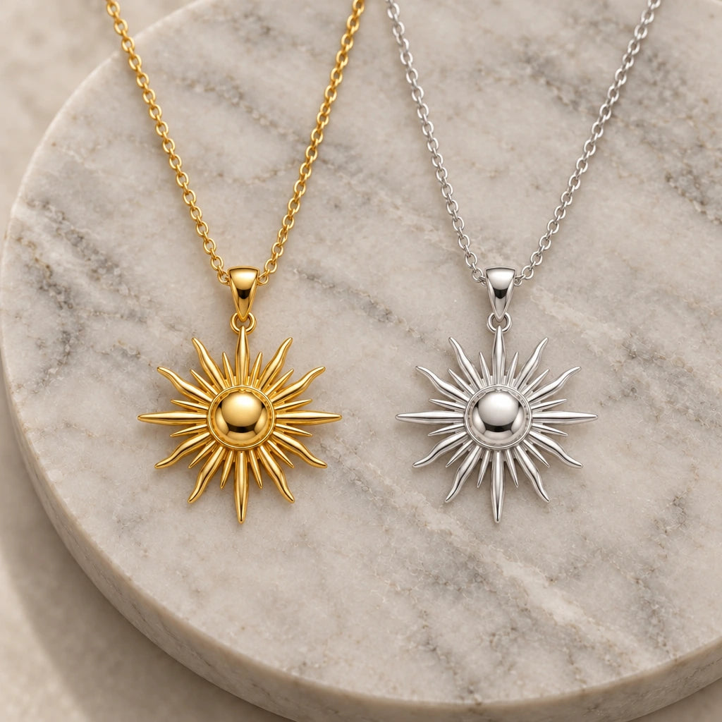 Radiant Sun Ray pendant necklace in silver and gold finishes side by side