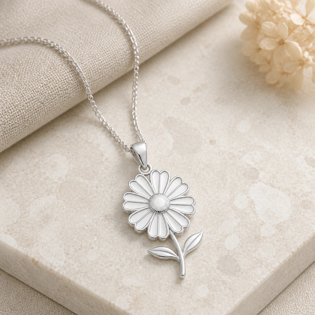 Close-up of silver cosmos bloom flower pendant showing the sculpted detail
