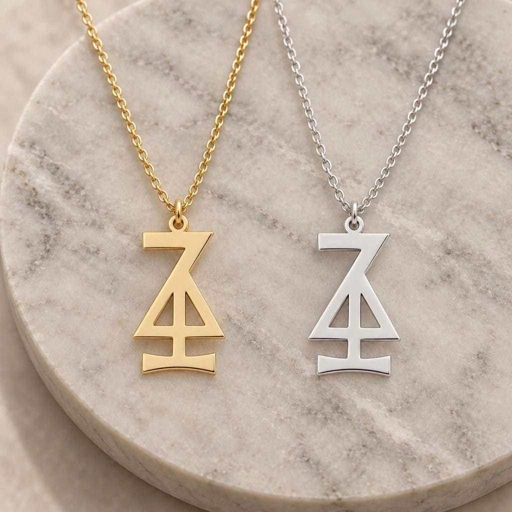 Hansa Asteroid Symbol pendant necklace in silver and gold finishes side by side