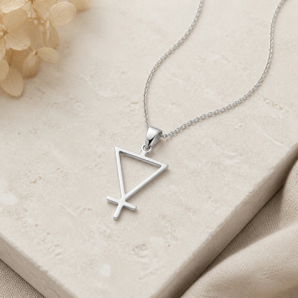Close-up of silver earth element pendant showing the sculpted detail