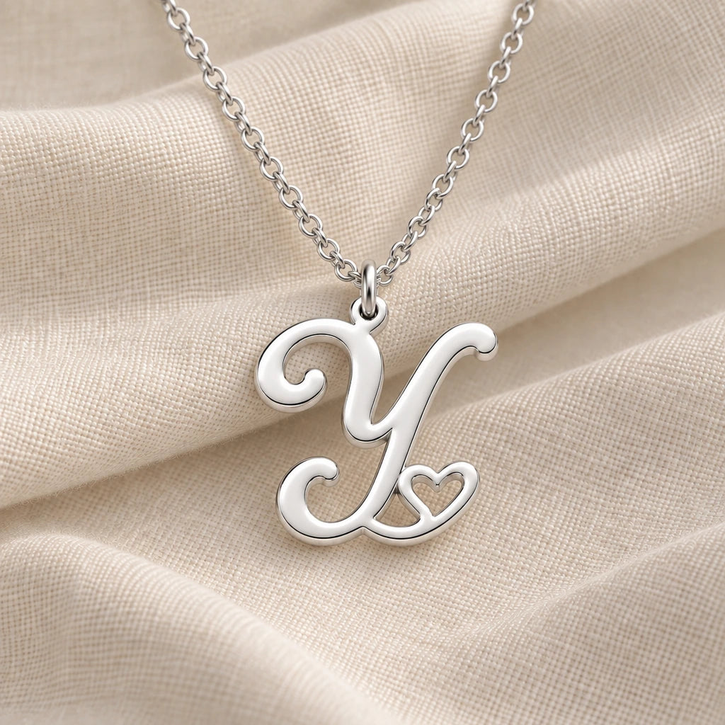 925 sterling silver y initial heart pendant necklace on softly folded cream linen