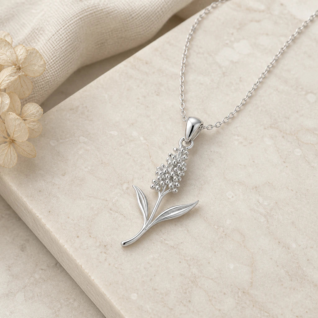 Close-up of silver hyacinth flower pendant showing the sculpted detail