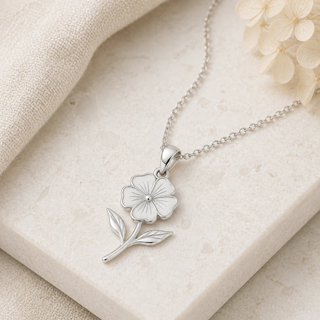 Close-up of silver phlox flower pendant showing the sculpted detail