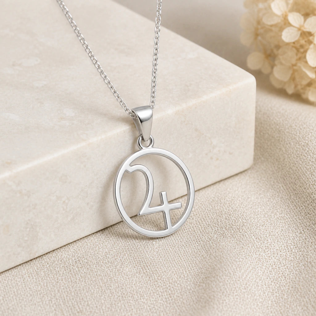 925 sterling silver jupiter symbol pendant necklace on softly folded cream linen