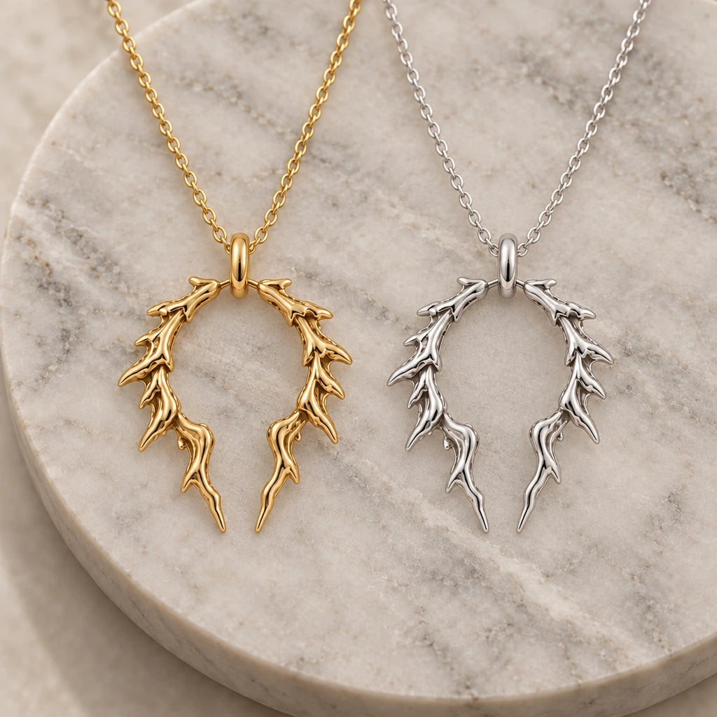 Broken Halo Thorn pendant necklace in silver and gold finishes side by side