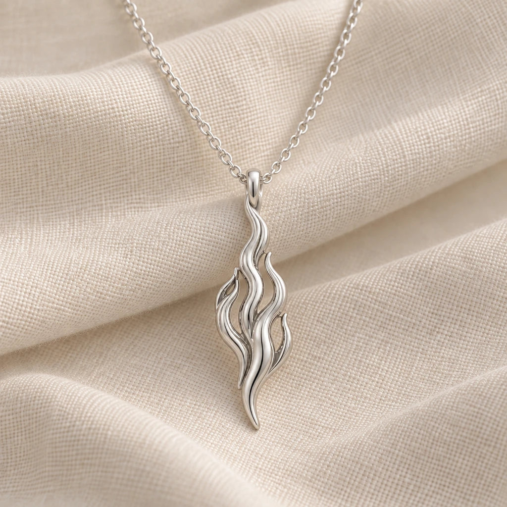 925 sterling silver flame of venus pendant necklace on cream fabric