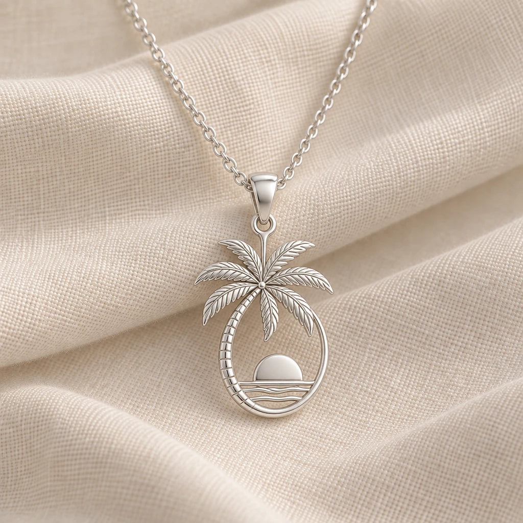 925 sterling silver palm sunset pendant necklace on cream fabric