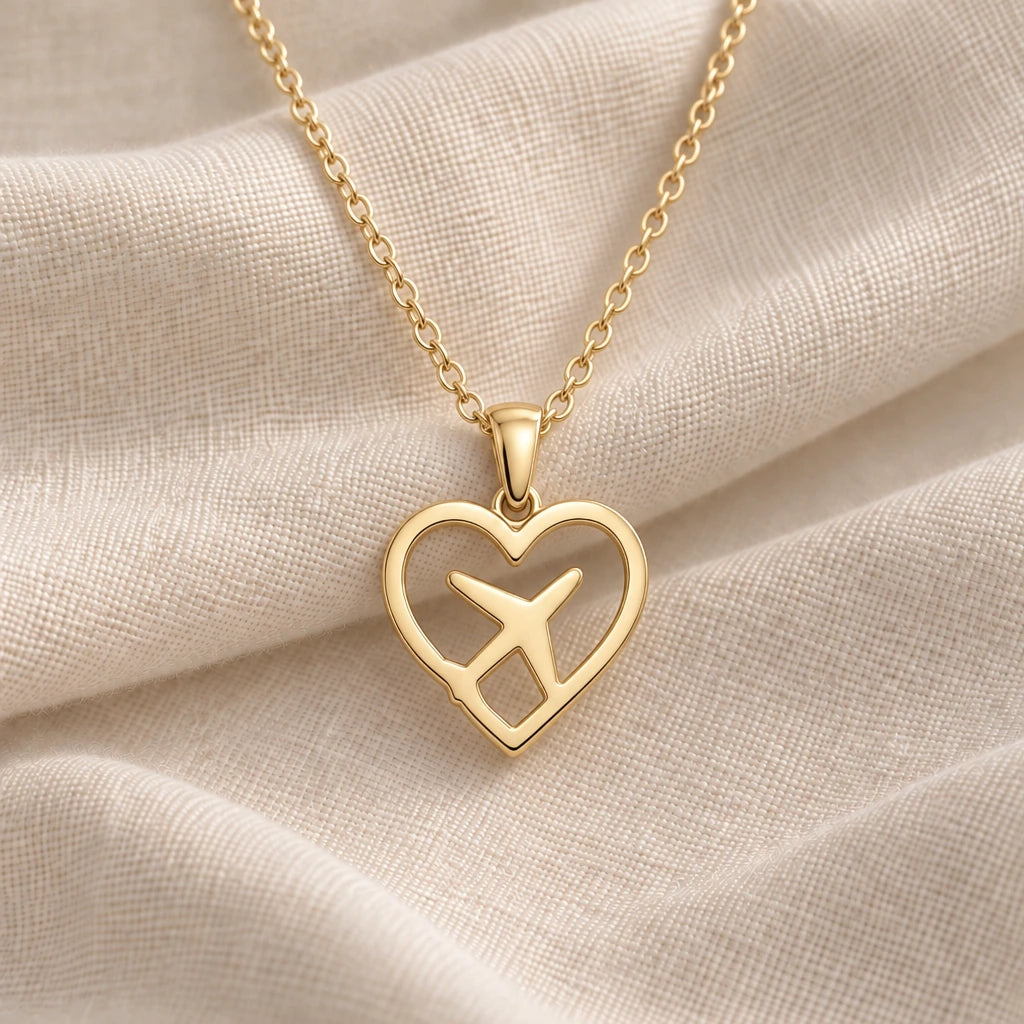 Heart Aeroplane pendant necklace in an 18k gold plated finish
