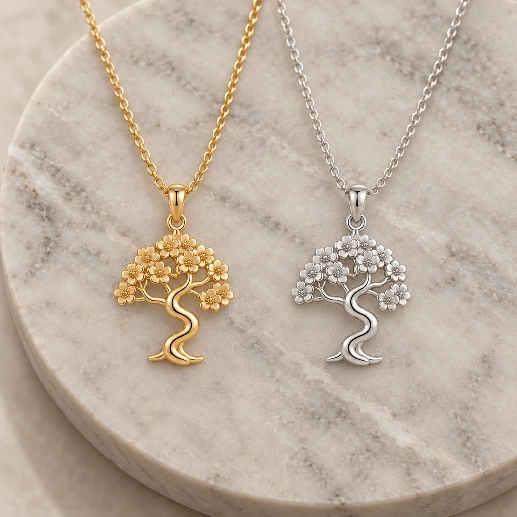 Sakura Cloud Bonsai pendant necklace in silver and gold finishes side by side
