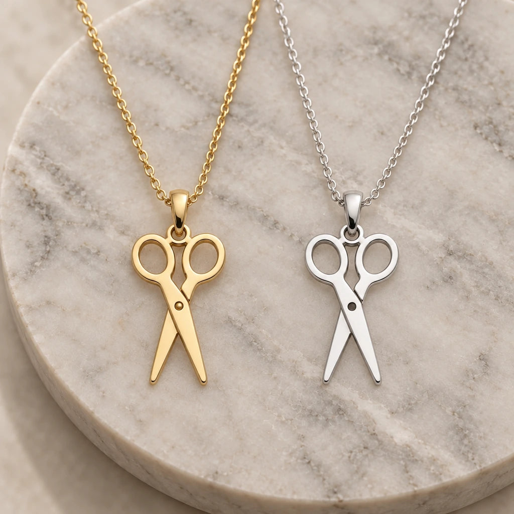Scissors pendant necklace in silver and gold finishes side by side