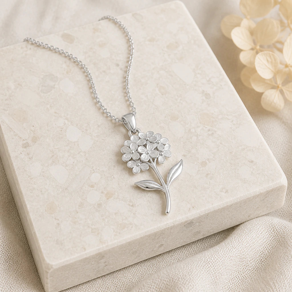Close-up of silver hydrangea flower pendant showing the sculpted detail