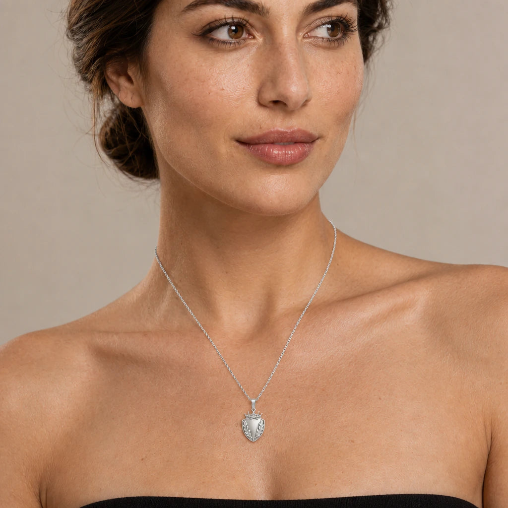 Oak Leaf Shield Crown pendant necklace worn by a model, natural lifestyle photograph