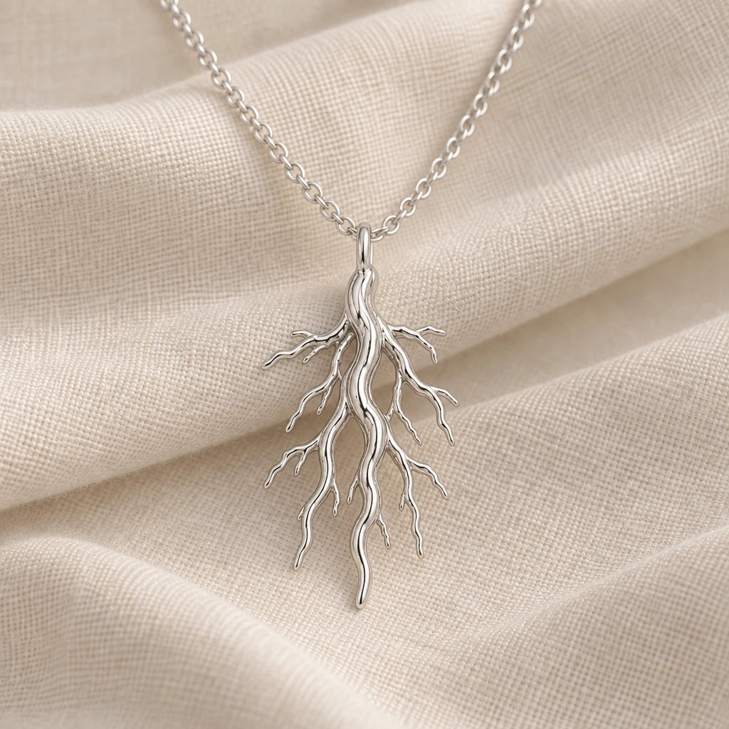925 sterling silver sacred root pendant necklace on cream fabric