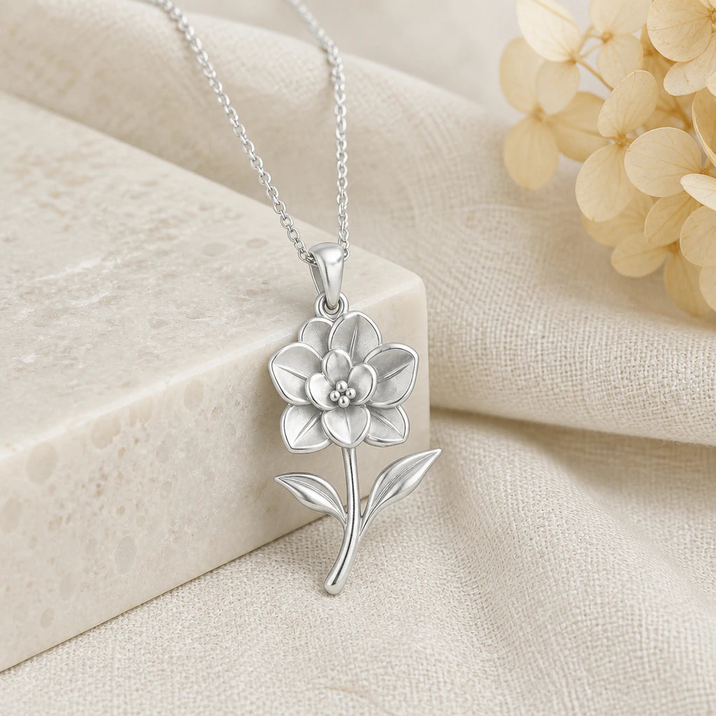 925 sterling silver gardenia flower pendant necklace on softly folded cream linen