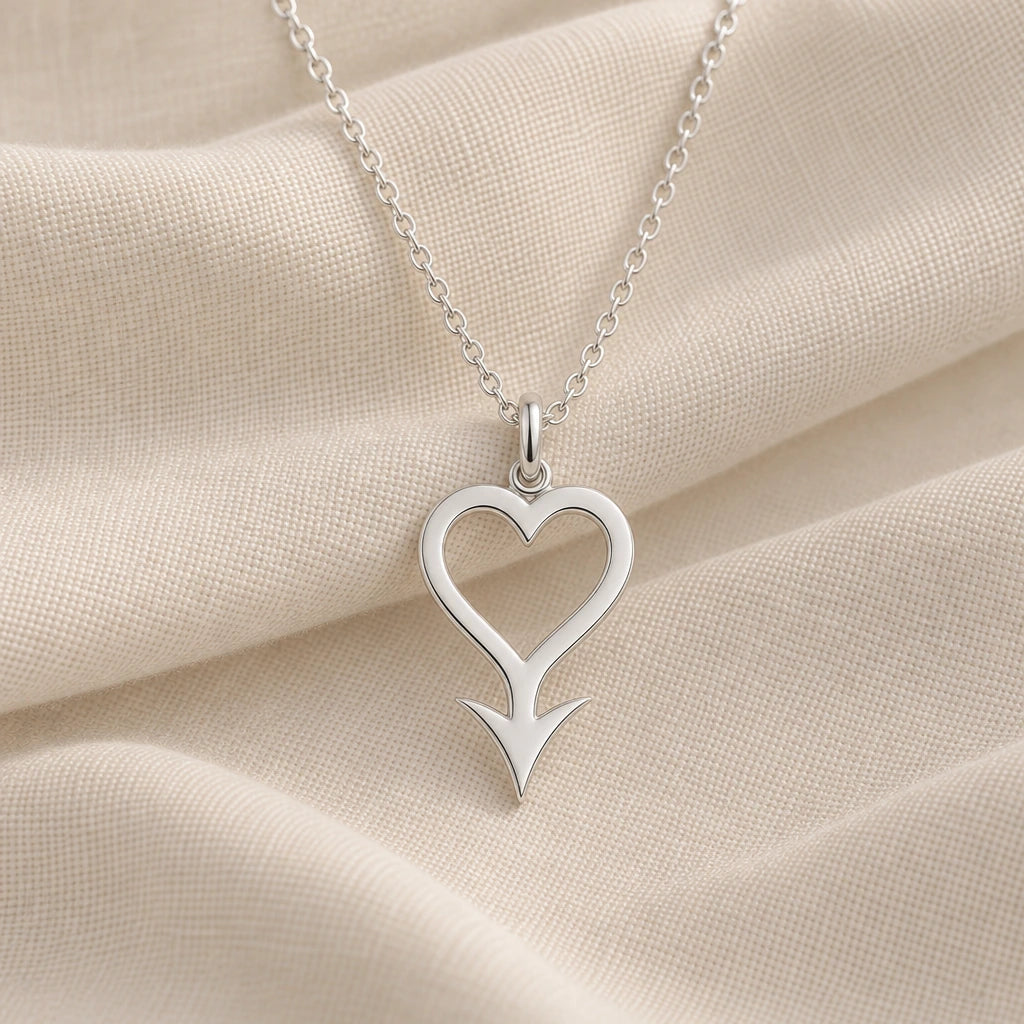 925 sterling silver cupido asteroid symbol pendant necklace on cream fabric