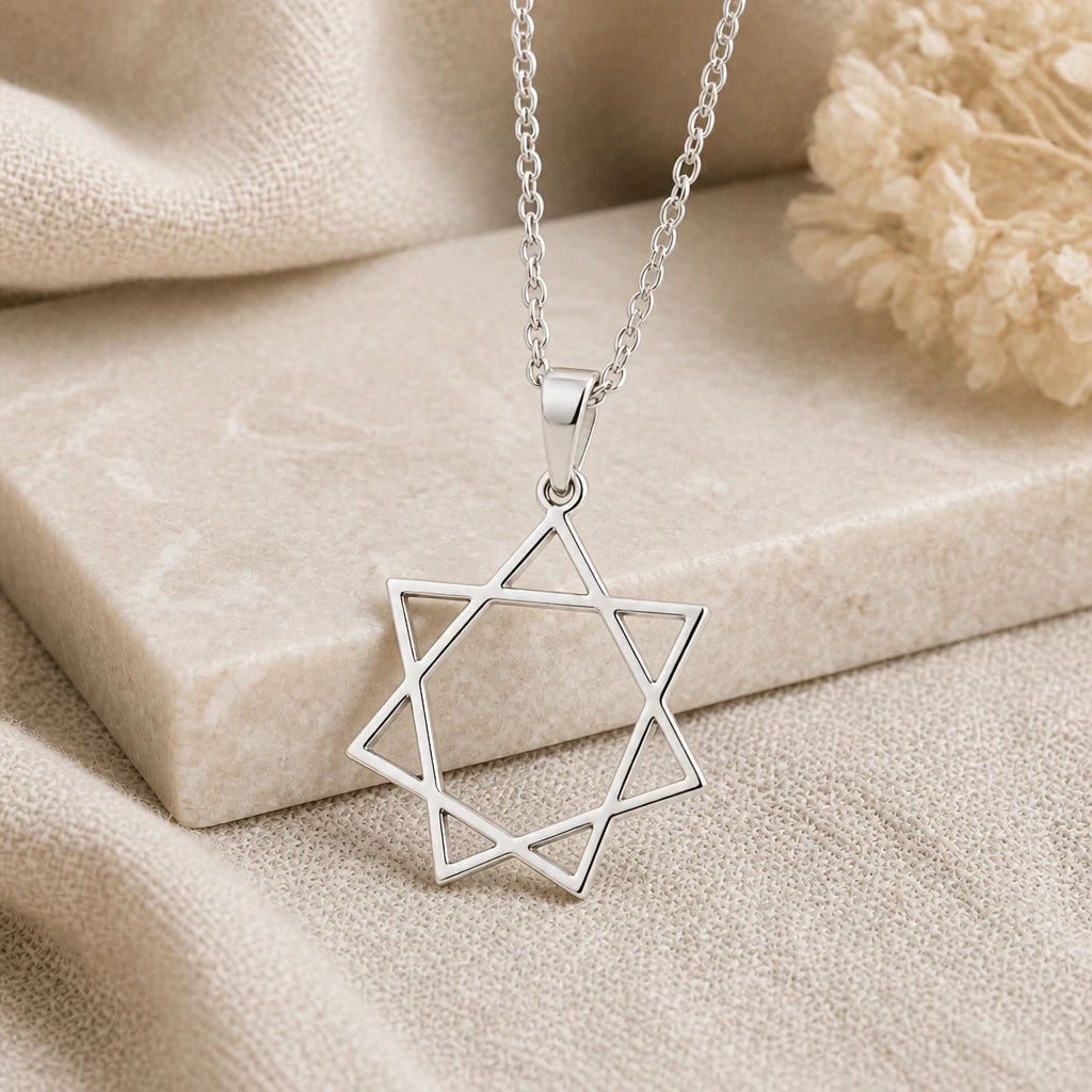 925 sterling silver seven pointed star pendant necklace on softly folded cream linen