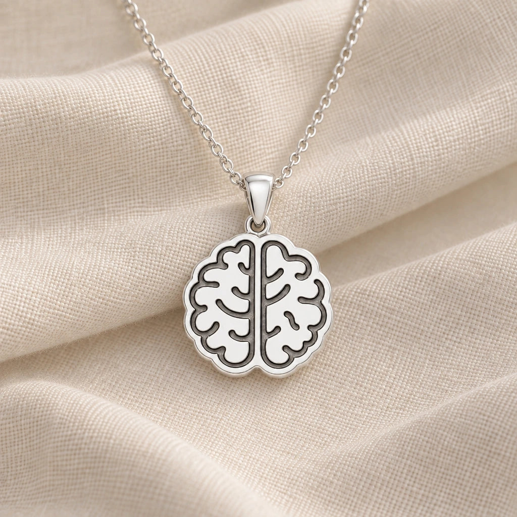 925 sterling silver brain pendant necklace on cream fabric