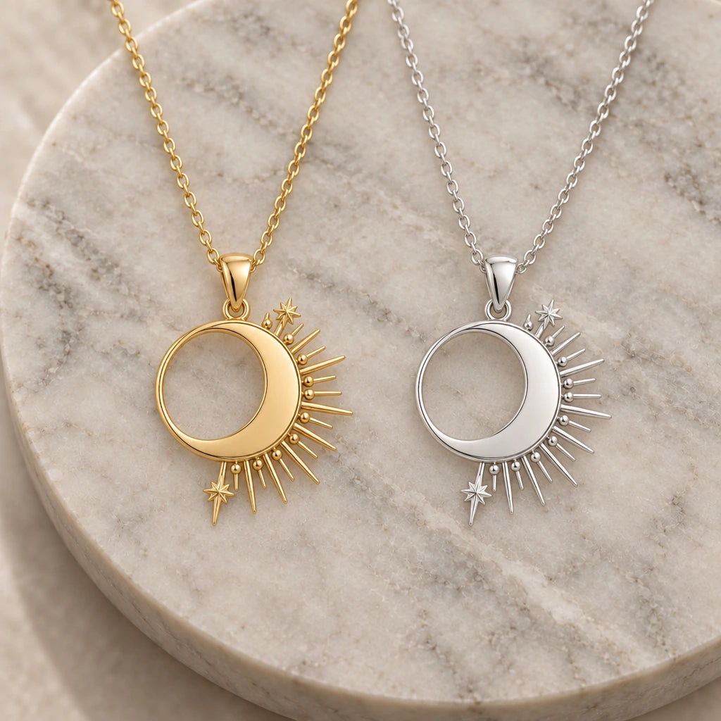 Solar Eclipse Crescent pendant necklace in silver and gold finishes side by side