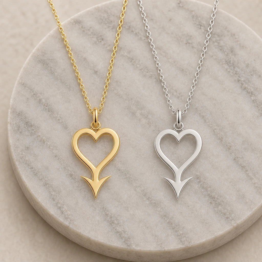 Cupido Asteroid Symbol pendant necklace in silver and gold finishes side by side
