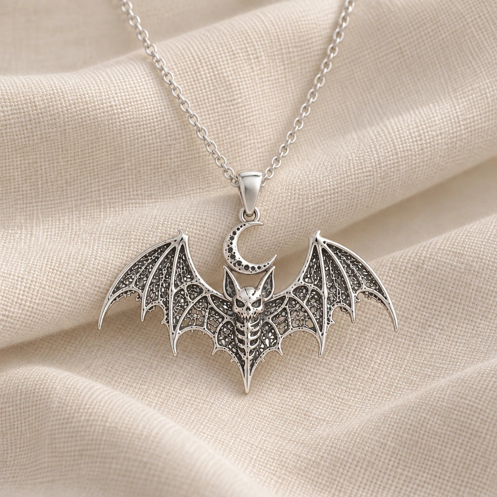 925 sterling silver lunar bat relic pendant necklace on cream fabric