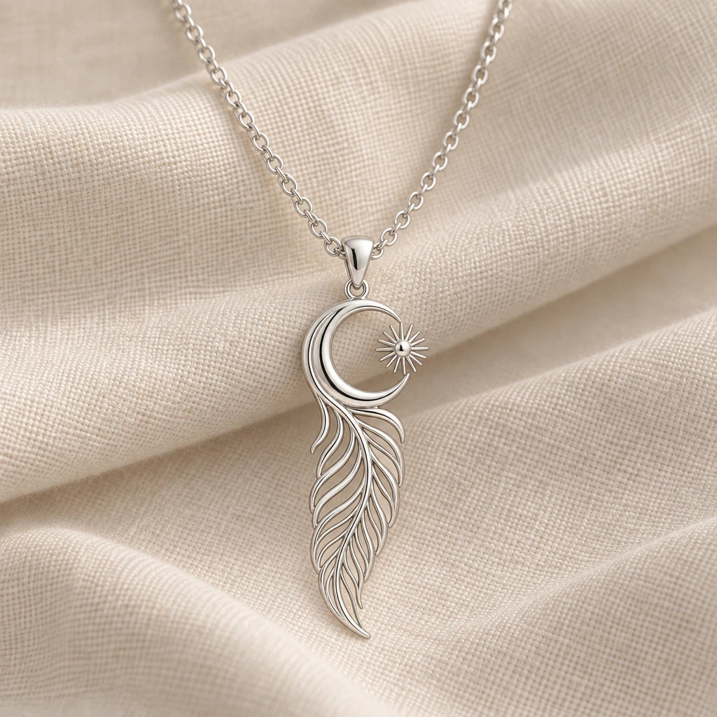 925 sterling silver eclipse feather moon pendant necklace on cream fabric