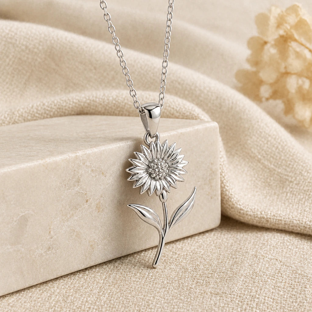 925 sterling silver cornflower pendant necklace on softly folded cream linen