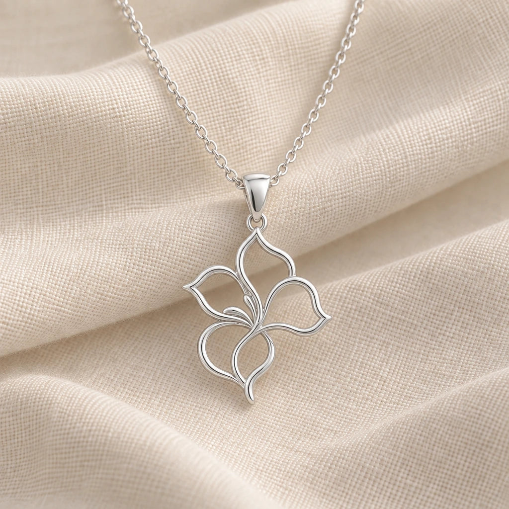 925 sterling silver velvet petal flower outline pendant necklace on cream fabric