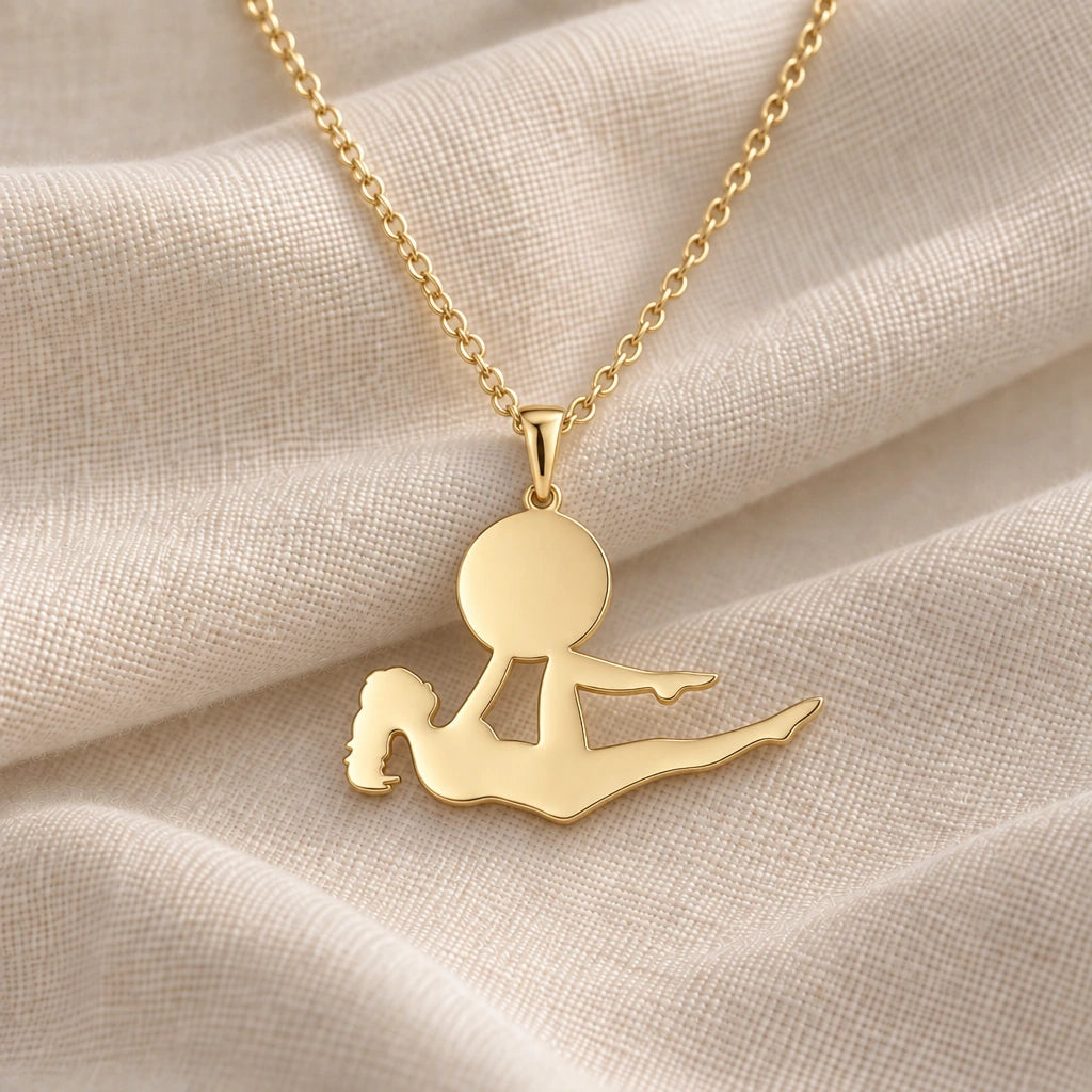 Yoga Bow Pose pendant necklace in an 18k gold plated finish