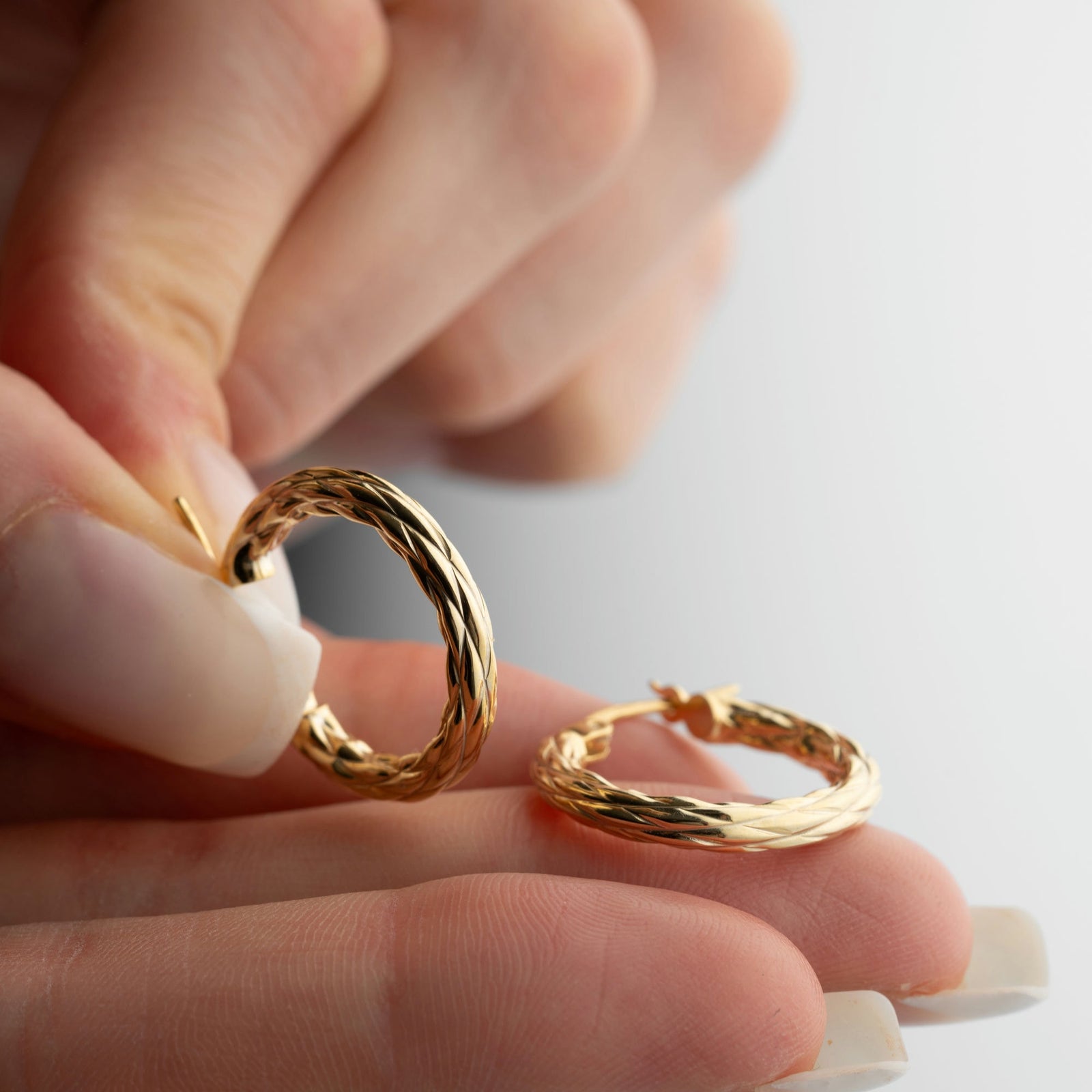 Gold twist hoop earrings