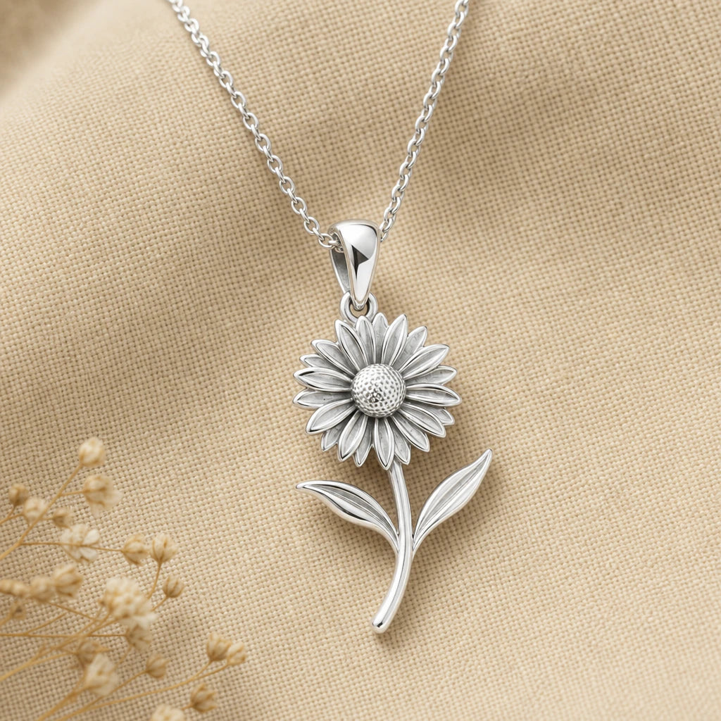 Gaillardia flower pendant necklace in polished 925 sterling silver on cream linen