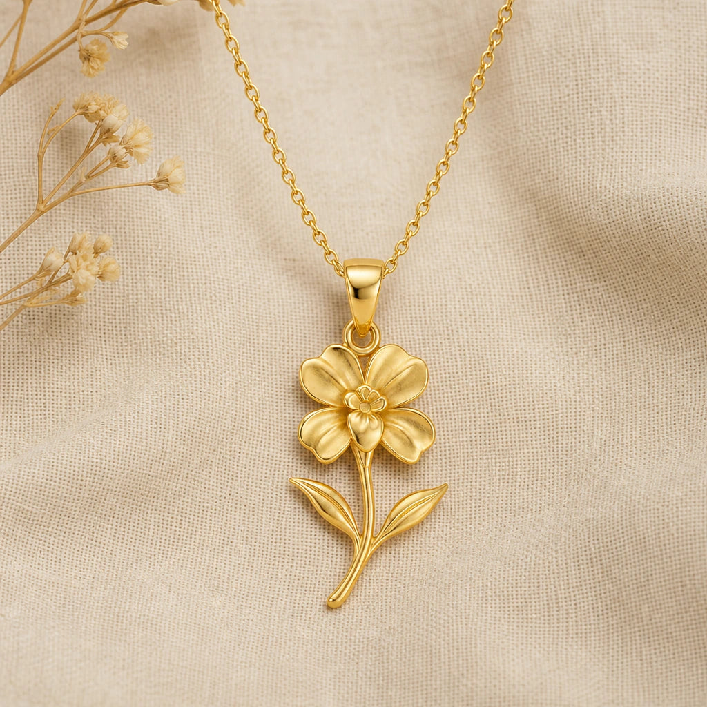 Impatiens flower pendant necklace in gold plated sterling silver on cream fabric
